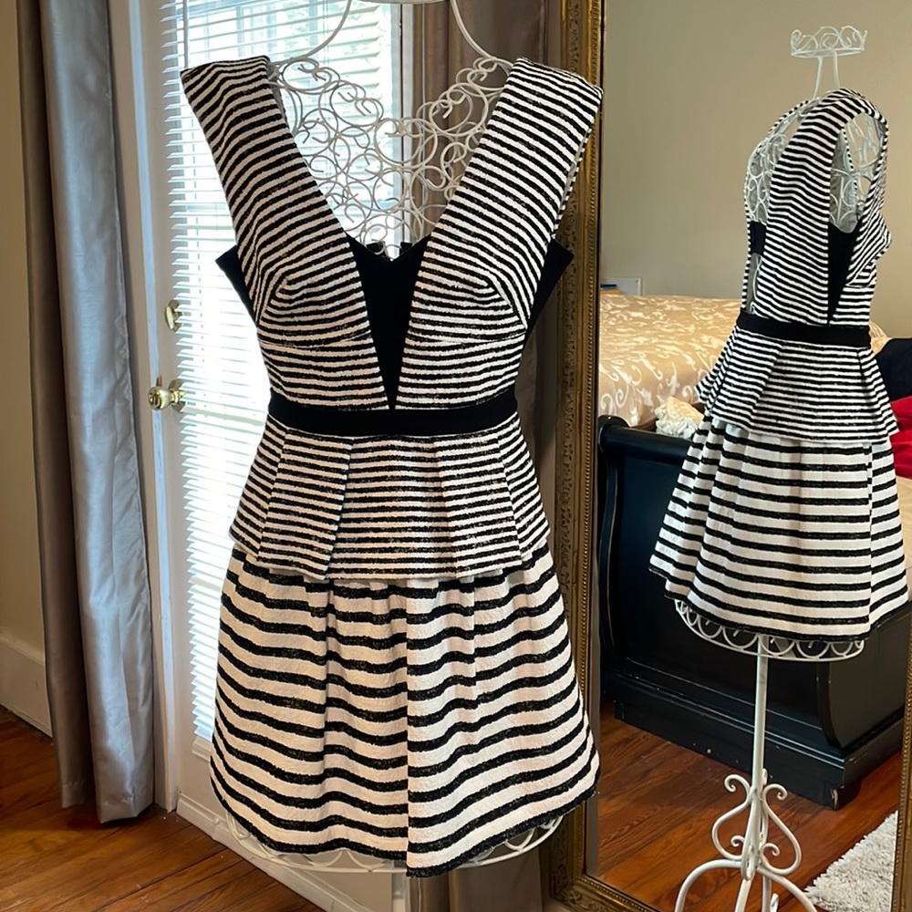 Sleeveless dress with peplum top